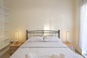 Ένα ή περισσότερα κρεβάτια σε δωμάτιο στο Festos Cozy, 2BR, AC, WiFi, Fully Equipped