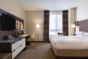 a hotel room with a bed and a flat screen tv at DoubleTree by Hilton Hotel Boston - Downtown in Boston