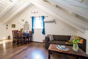 a living room with a couch and a table at Plaza Royal in the centre in Dubrovnik