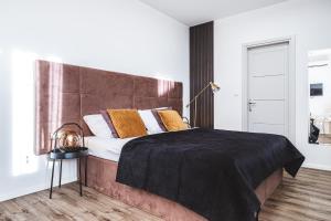 Ein Bett oder Betten in einem Zimmer der Unterkunft National Plus