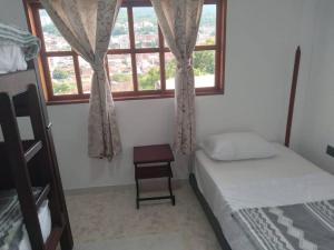 Katil atau katil-katil dalam bilik di Casa bonita en San Gil