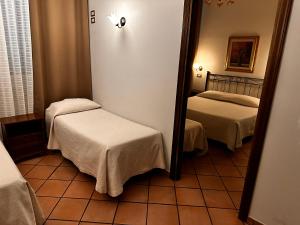 Postel nebo postele na pokoji v ubytování Hotel Kursaal & Ausonia