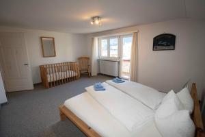 Postel nebo postele na pokoji v ubytování Villa Hartenfels 3