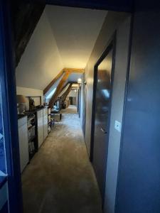 an attic hallway with a door and a room at Maison de 4 chambres avec jardin clos et wifi a Arcy Sainte Restitue in Arcy-Sainte-Restitue
