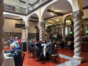 a group of people sitting at tables in a restaurant at HOTEL VIRREYNAL in Teziutlán +19 photos