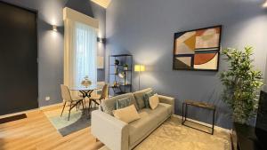 a living room with a couch and a table at MyTrip Porto in Matosinhos