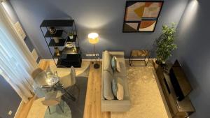 a living room with a couch and a table at MyTrip Porto in Matosinhos