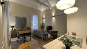 a living room with a couch and a table at MyTrip Porto in Matosinhos