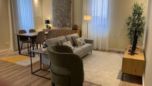 a living room with a couch and a table at MyTrip Porto in Matosinhos