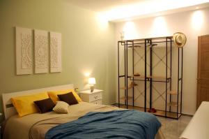 a bedroom with a bed and a book shelf at Dimore del Sud in Trani