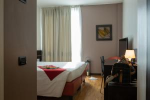 Postel nebo postele na pokoji v ubytování Euro Hotel Residence