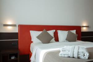 Postel nebo postele na pokoji v ubytování Euro Hotel Residence