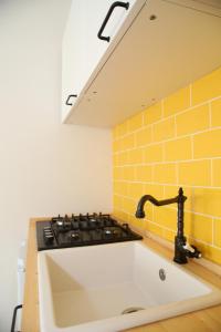 a kitchen with a sink and a stove at Princess Apartment 2 - Turin - Like at Your Home in Turin +45 photos