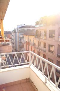 a balcony with a white railing and buildings at Princess Apartment 2 - Turin - Like at Your Home in Turin