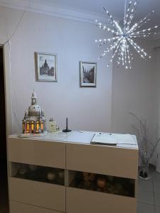 a kitchen with a counter with a star light at Apartments und Zimmer Gästehaus Matthias in Dresden