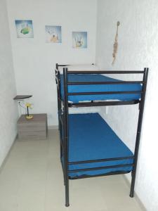 Ένα ή περισσότερα κρεβάτια σε δωμάτιο στο Pesciolino Blu