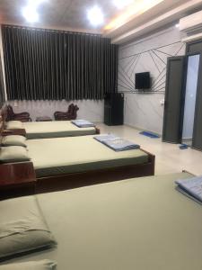 Tempat tidur dalam kamar di Nhà Nghỉ A&Em