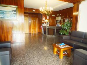 a living room with a couch and a table at Hotel Estalagem Turismo in Bragança +99 photos