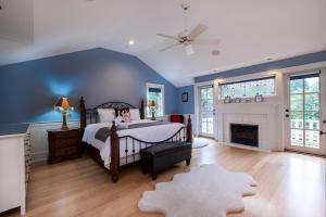 a bedroom with a bed and a fireplace at Vancouver Golf Villa - Private Oasis in Vancouver