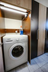 a washer and dryer in a small room at Central Apartments in Volos