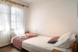 Postel nebo postele na pokoji v ubytování Avdira Seaside House
