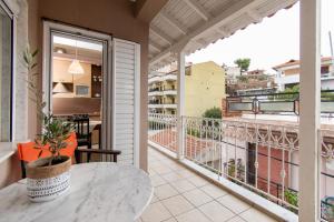 a balcony with a table and a view at Cristina Apartment 2 in Neos Marmaras