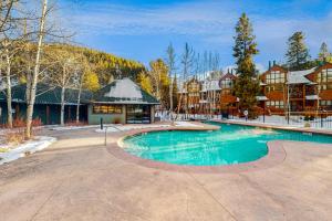 a large swimming pool in front of a building at Northstar Townhome Unit 1968 in Keystone