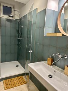 a bathroom with a shower and a sink at Almond Studio Apartment in Bratislava +2 photos