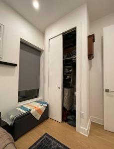 a room with a closet with a bed in it at Modern 1-bedroom in Manhattan-New York, NY in New York