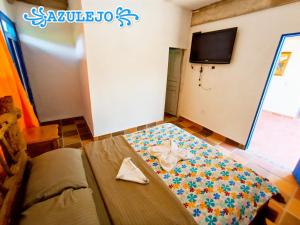 A bed or beds in a room at AZULEJO