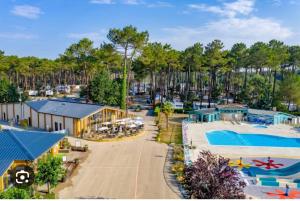 an aerial view of a resort with a pool at Les Dunes de Contis in Saint-Julien-en-Born