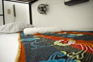 Un ou plusieurs lits dans un hébergement de l'établissement Hostal Loco Coco Loco