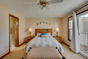 a bedroom with a bed and a ceiling fan at Loveland Townhome Walkable to Lake and Park! in Loveland