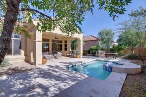 a house with a swimming pool in a yard at Spacious North Phoenix Oasis with Pool and Patio! in Phoenix