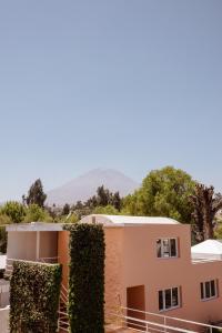 a house with a hedge in front of it at La Posada del Puente in Arequipa