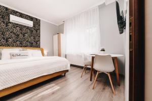 Posteľ alebo postele v izbe v ubytovaní Oliver Apartman