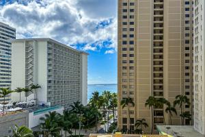 a view of the ocean from the balcony of a resort at Waikiki Haven in Honolulu