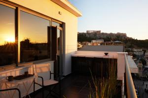 a balcony with a view of a city at Zoe Monastiraki in Athens +47 photos
