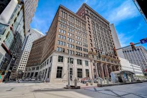 a large building on the corner of a city street at 1600 KCM Penthouse Apartment in Cleveland
