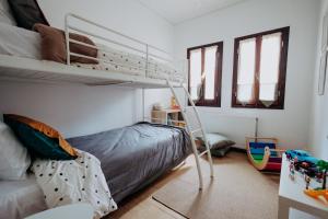 a bedroom with a bunk bed with a ladder at Villa Andromeda Pelion in Portaria