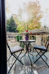 a patio with a table and chairs and a gazebo at Villa Andromeda Pelion in Portariá