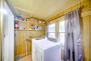 a laundry room with a washer and a window at Less Than 1 Mi to Vineyard Historic Farnam Home! in Farnam +19 photos