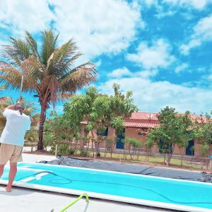 Kolam renang di atau dekat dengan Casa na Praia com Piscina