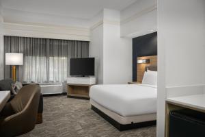 a hotel room with a bed and a television at SpringHill Suites by Marriott Annapolis in Annapolis