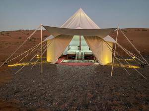 a tent in the middle of the desert at Desert waves camp in Bidiyah