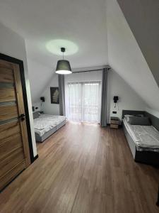 Posteľ alebo postele v izbe v ubytovaní Małe Ciche 36j PRZY OSTREWKACH, Widok na góry, Blisko do wyciągu narciarskiego, Idealne miejsce na wypad w góry -tarasówka-zgorzelisko-rusinowa polana-gesia szyja-palenica-wiktorówki-morskie oko