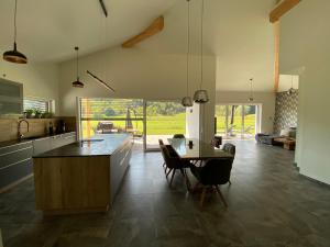 a kitchen and dining room with a table and chairs at Ferienhaus BUK in Hermagor