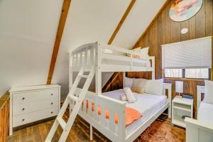 a white bunk bed in a room with a ladder at Hot Tub and Resort Amenities Pocono Lake Retreat! in Pocono Lake +35 photos