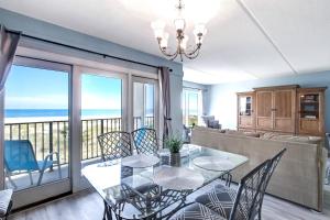 a dining room with a view of the ocean at 112 Oceans Of Amelia in Amelia Island