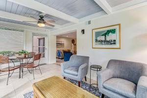 a living room with two chairs and a table at 3325 Fairway Oaks in Amelia Island